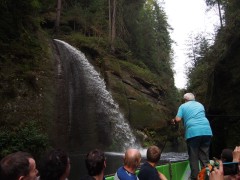 Boatman is turning on the waterfall