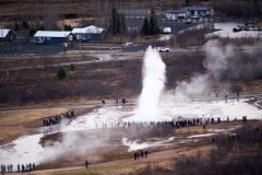 Tourists taking pictures of the Geysir geysir